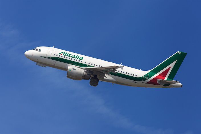 Ex-Alitalia flight attendants strip off uniforms in protest