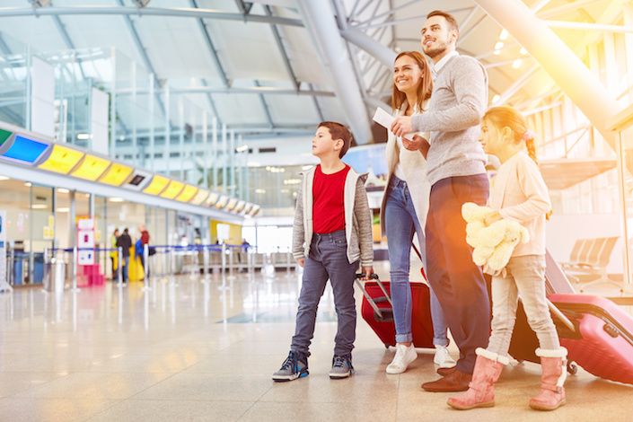 Travelers plan to spend time with family during the holidays, but cautiously