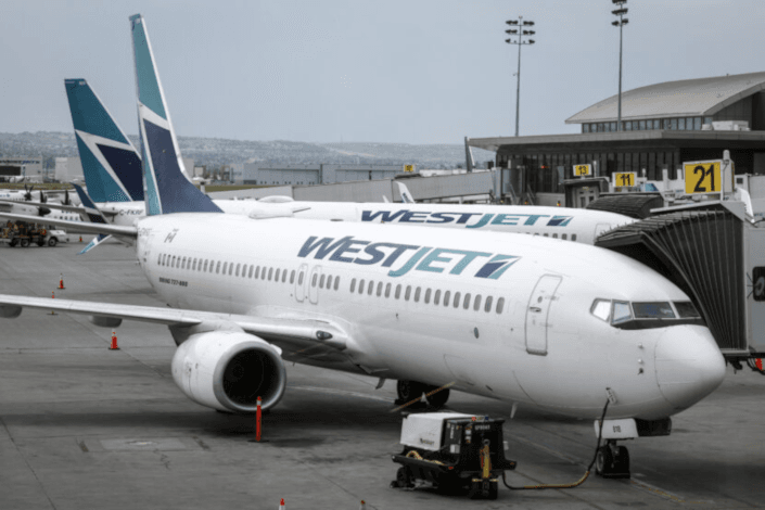 WestJet raises checked bag fees again